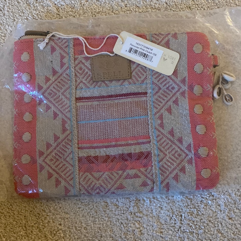 Spell designs Peruvian pink clutch